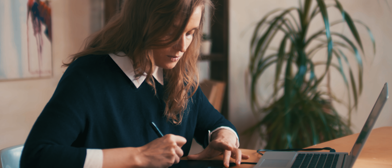 woman at computer writing_0